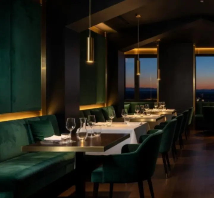 Cinematic interior of Au Ssiezen with warm ambient lighting and elegant table settings.